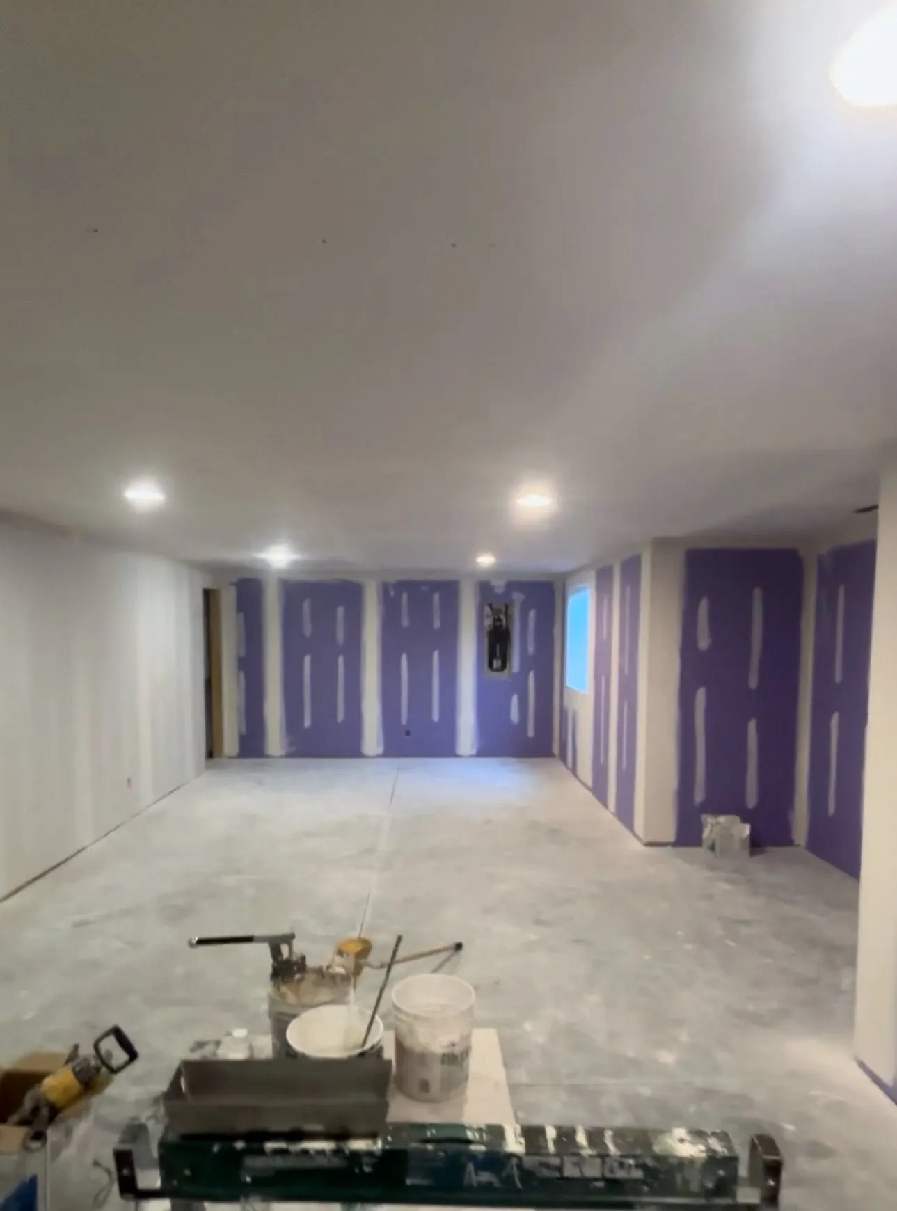 Basement with new drywall and recessed lights