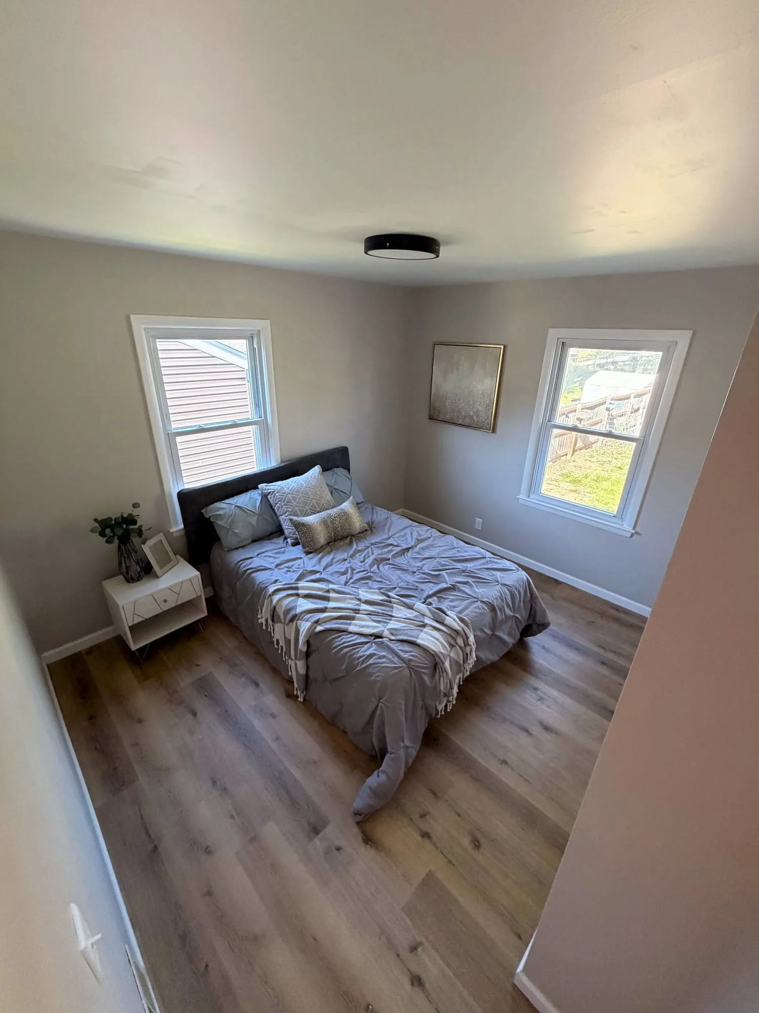 Finished bedroom with new wood-look vinyl plank flooring