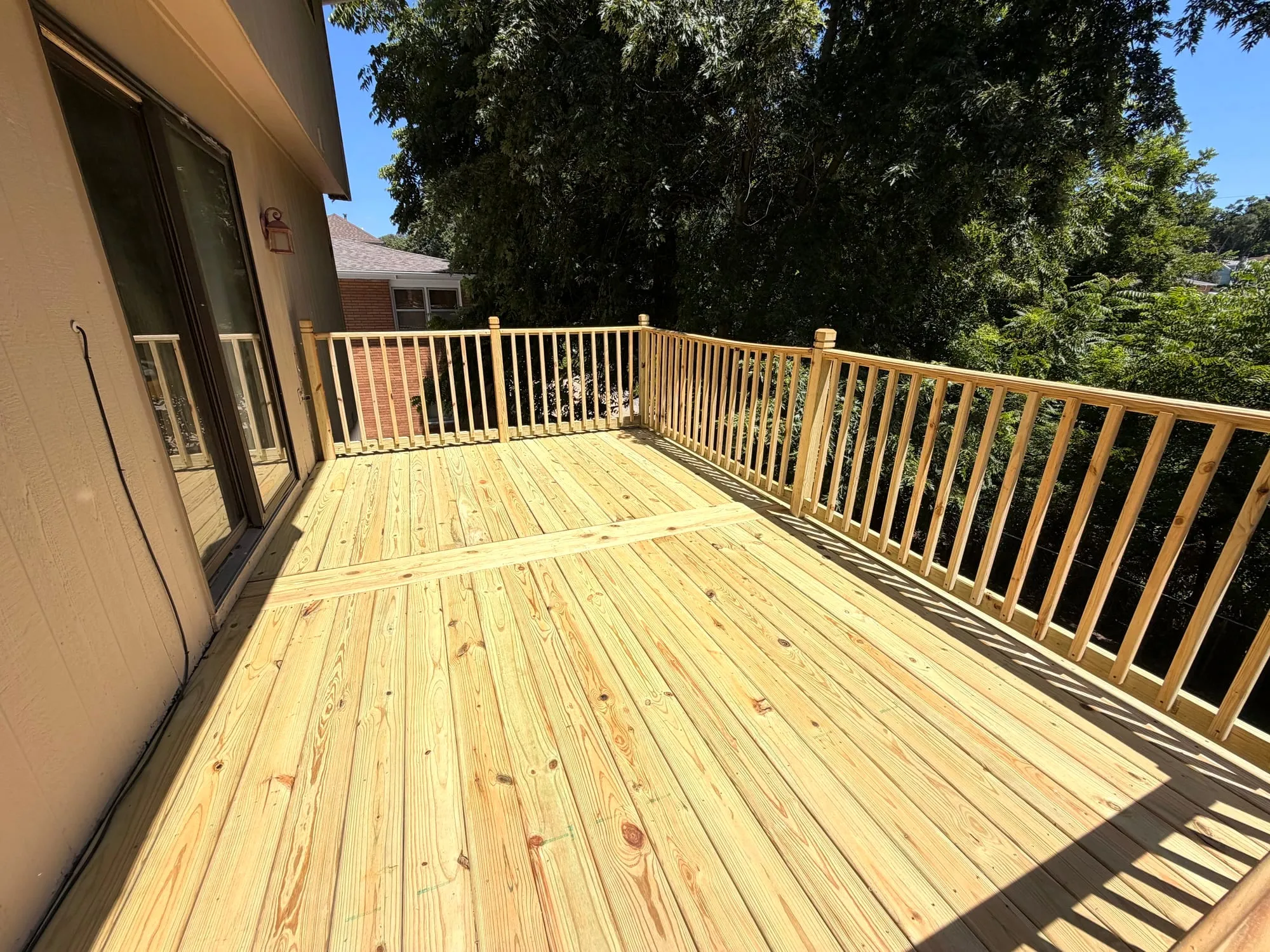 New treated-wood deck boards and railing