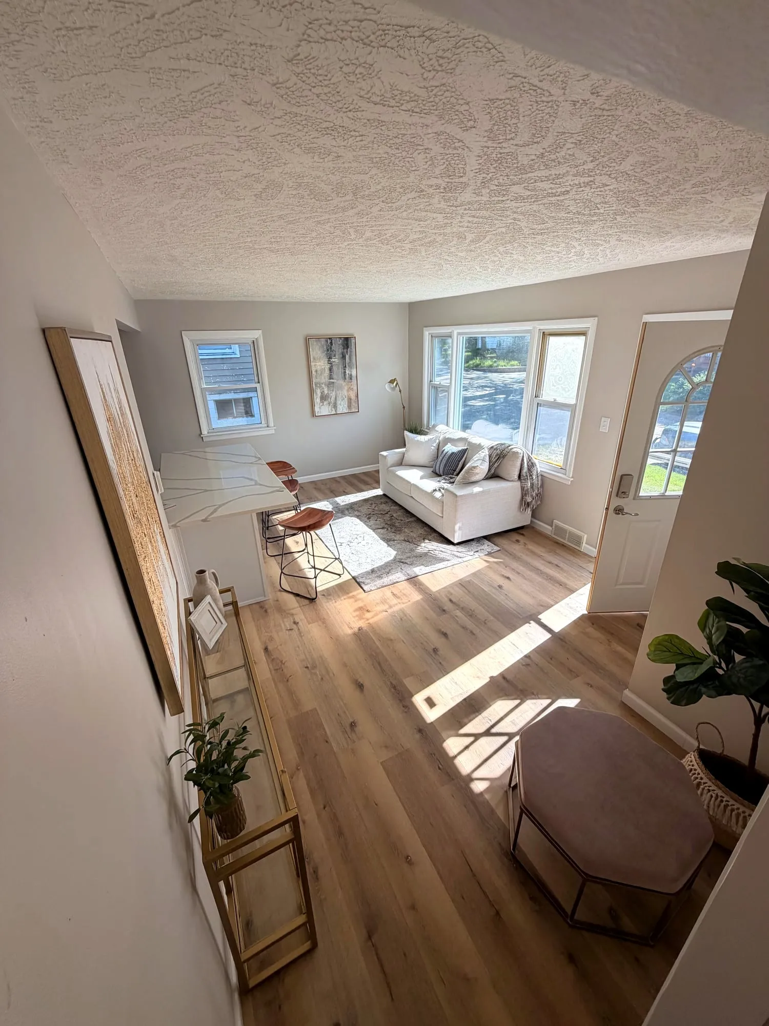 Finished living room with new flooring and fresh paint
