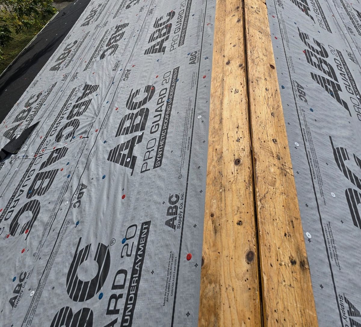 Roof replacement in progress, new underlayment down and the ridge opened for a vent